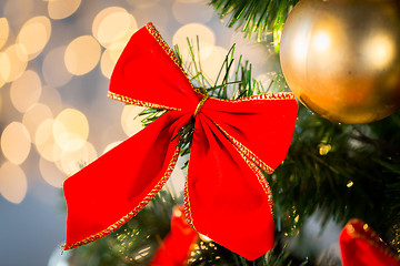 Image showing close up of red bow decoration on christmas tree