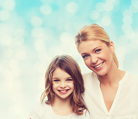 Image showing smiling mother and little girl