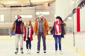 Image showing happy friends on skating rink