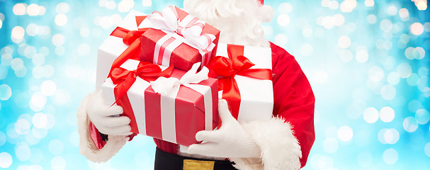 Image showing close up of santa claus with gift boxes