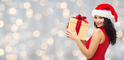 Image showing beautiful sexy woman in santa hat with gift box