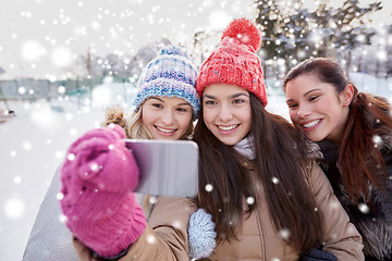 Image showing happy teenage girls taking selfie with smartphone