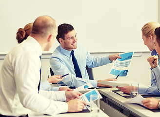 Image showing business people with papers meeting in office