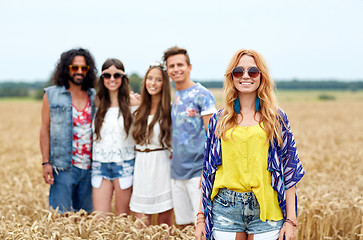 Image showing smiling young hippie friends on cereal field