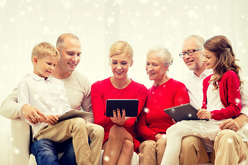 Image showing smiling family with tablet pc computers at home