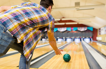 Image showing close up of man throwing ball in bowling club