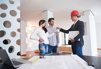 Image showing couple buying new home with real estate agent