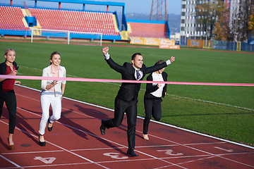 Image showing business people running on racing track