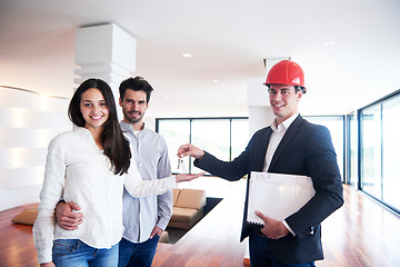 Image showing couple buying new home with real estate agent