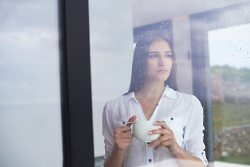 Image showing beautiful young woman drink first morning coffee