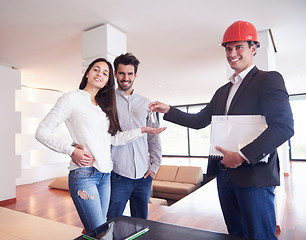 Image showing couple buying new home with real estate agent