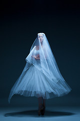 Image showing Portrait of the ballerina on blue background