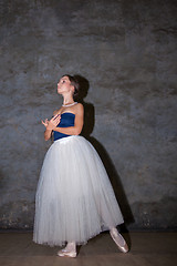 Image showing The beautiful ballerina posing in long white skirt 