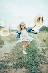 Image showing The young girl on green grass background 