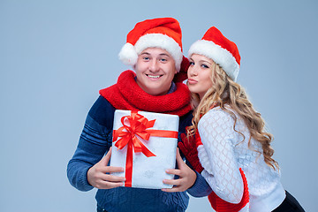 Image showing Lovely christmas couple holding presents