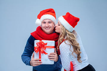 Image showing Lovely christmas couple holding presents