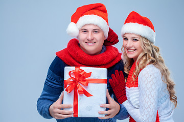 Image showing Lovely christmas couple holding presents