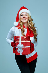 Image showing Beautiful young woman in Santa Claus clothes