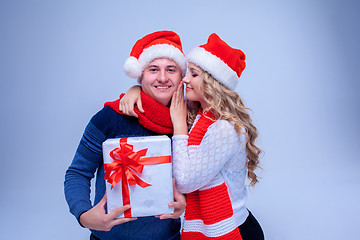 Image showing Lovely christmas couple holding presents