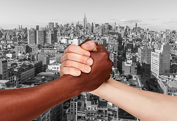 Image showing Business Handshake against  Manhattan skyscrapers