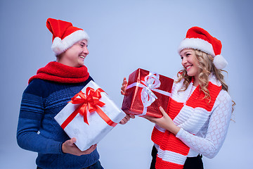 Image showing Lovely christmas couple holding presents