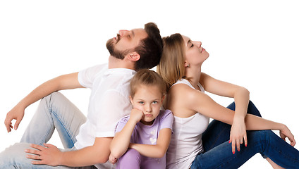 Image showing The tired family sitting on white background