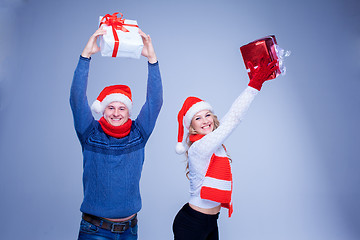 Image showing Lovely christmas couple holding presents