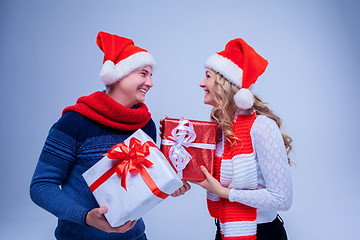 Image showing Lovely christmas couple holding presents