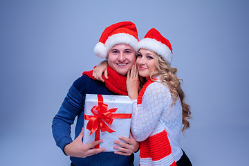 Image showing Lovely christmas couple holding presents