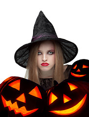 Image showing Halloween witch with a carved pumpkin