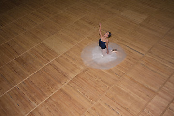 Image showing The beautiful ballerina posing in long white skirt 