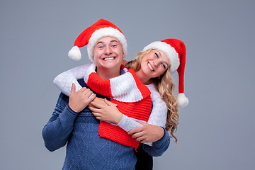 Image showing Lovely christmas couple in Santa Claus hats