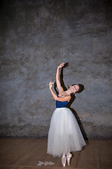 Image showing The beautiful ballerina posing in long white skirt 