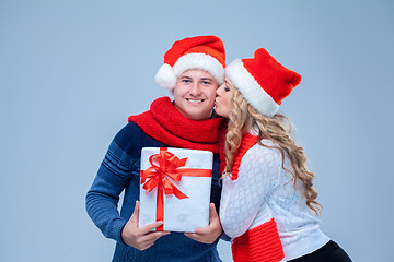 Image showing Lovely christmas couple holding presents