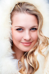 Image showing Portrait of blond young woman in fur coat 