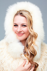 Image showing Portrait of blond young woman in fur coat 
