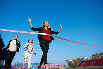 Image showing business people running on racing track