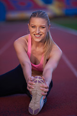 Image showing sporty woman on athletic race track