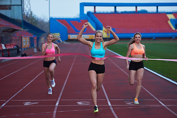 Image showing Female Runners Finishing Race Together