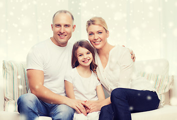 Image showing smiling parents and little girl at home