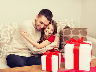 Image showing smiling father and daughter hugging