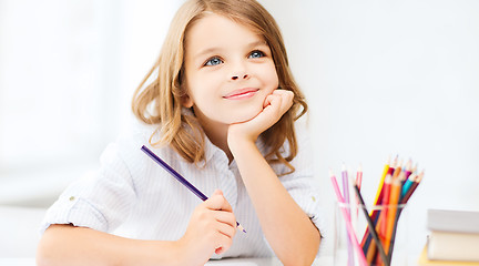 Image showing girl drawing with pencils at school