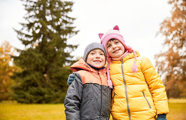 Image showing happy little girl and boy in autumn park