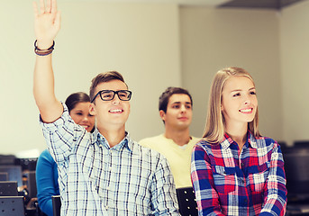 Image showing group of smiling students in lecture hall