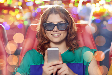 Image showing happy woman with smartphone in 3d movie theater