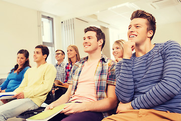 Image showing group of smiling students in lecture hall