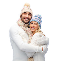 Image showing smiling couple in winter clothes hugging