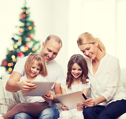 Image showing happy family with tablet pc computers