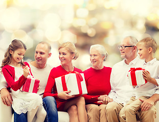 Image showing smiling family with gifts