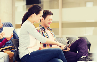 Image showing group of smiling students with tablet pc